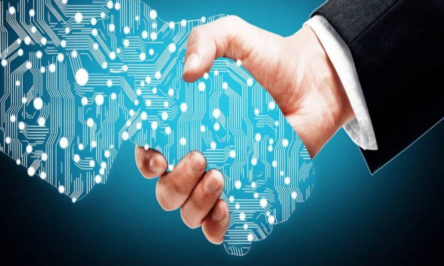 IT management User shaking hands with a digital counterpart after IT adoption